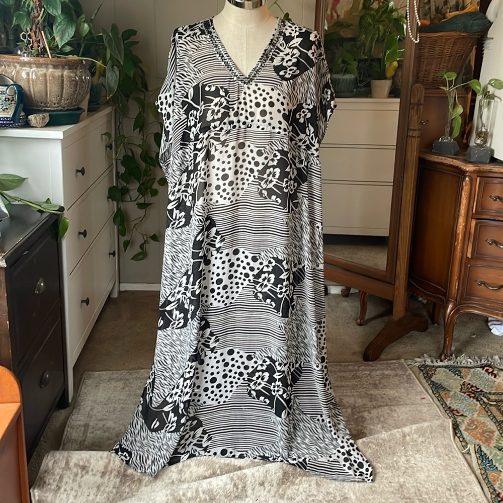Fun & Flirt sheer mixed print poncho/cover up
